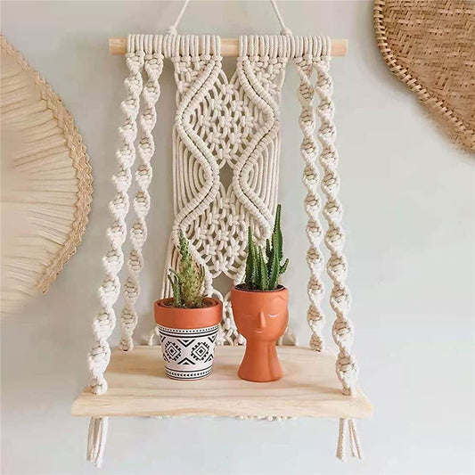 Macramé wall shelf with wooden base holding small indoor plants – Urban Nest 